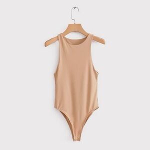 - Bodysuit
- NWT - Boutique 
- Nude 
- Available in small, medium, large